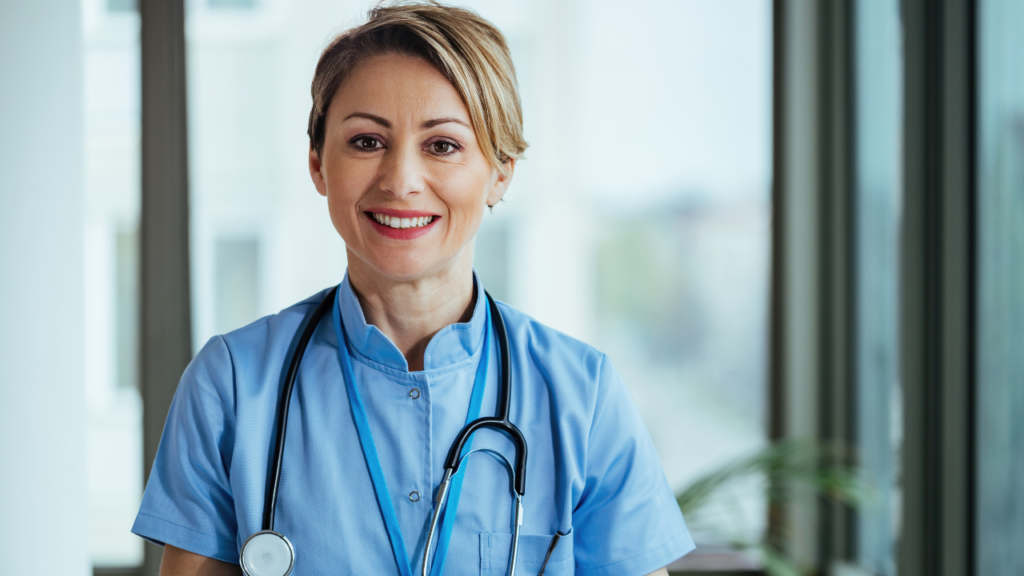 portrait-smiling-nurse-looking-camera-while-standing-clinic.jpg